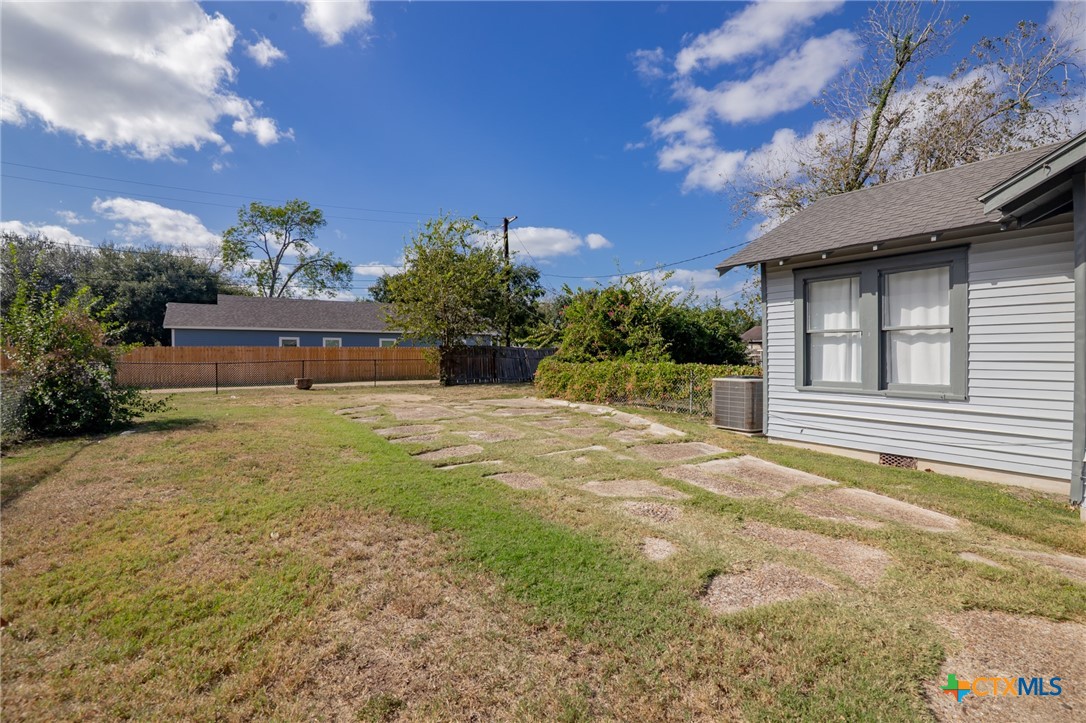 3109 North Main Street Victoria, TX 77901 - Photo 25 of 29 a front view of a house with a yard