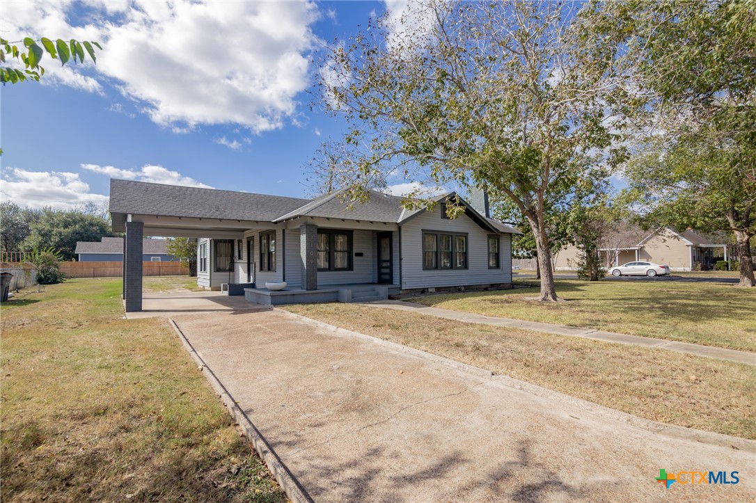 3109 North Main Street Victoria, TX 77901 - Photo 29 of 29 a front view of a house with a yard and garage