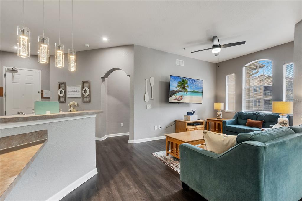 505 Terrace Ridge Circle, Unit 505 Davenport, FL 33896 - Photo 17 of 47 a living room with furniture and a wooden floor