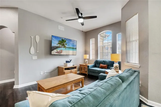 a living room with furniture and a large window