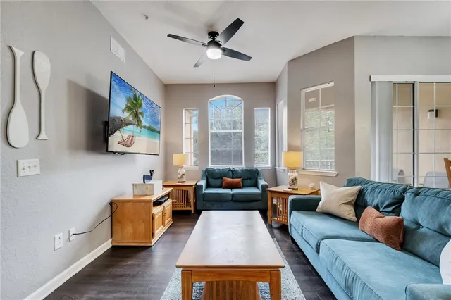 a living room with furniture and a rug