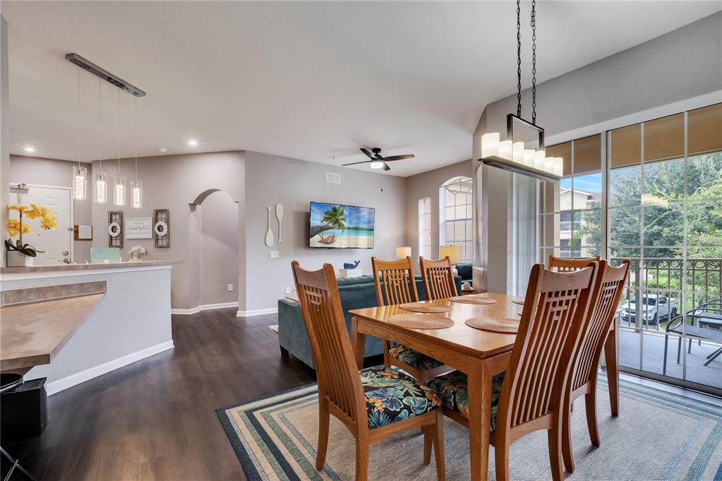 505 Terrace Ridge Circle, Unit 505 Davenport, FL 33896 - Photo 22 of 47 a view of a dining room with furniture window and wooden floor