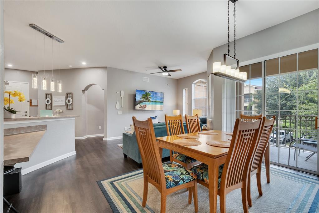 505 Terrace Ridge Circle, Unit 505 Davenport, FL 33896 - Photo 25 of 47 a view of a dining room with furniture window and wooden floor