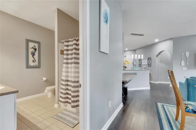 a bathroom with a sink a large mirror and a shower