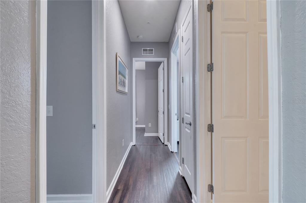 505 Terrace Ridge Circle, Unit 505 Davenport, FL 33896 - Photo 29 of 47 a view of a hallway with wooden floor