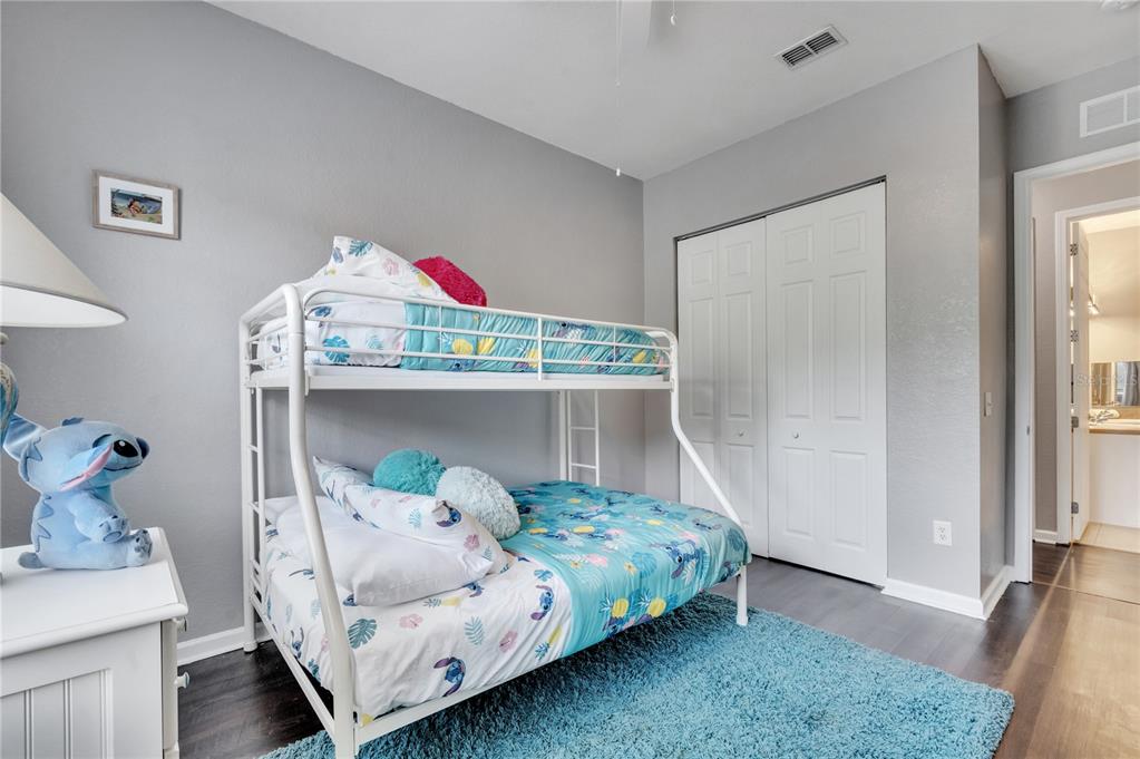 505 Terrace Ridge Circle, Unit 505 Davenport, FL 33896 - Photo 32 of 47 a bedroom with a bed and a window