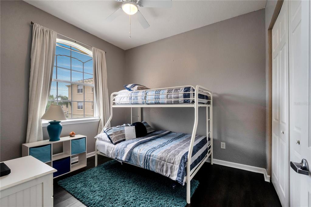 505 Terrace Ridge Circle, Unit 505 Davenport, FL 33896 - Photo 36 of 47 a bedroom with a bed and a window