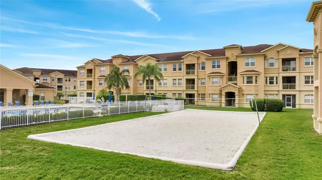 a front view of a house with swimming pool having outdoor seating