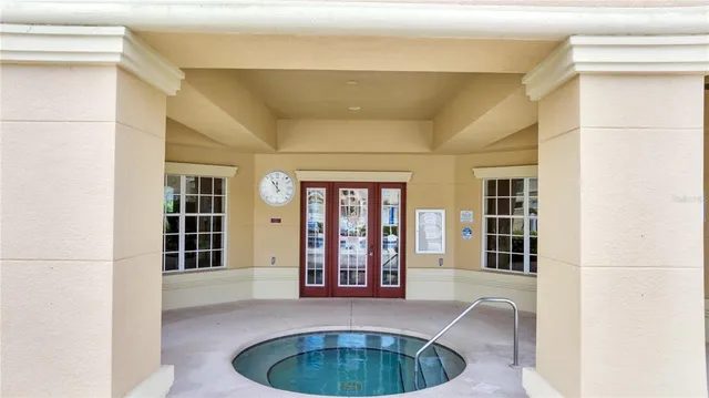 a view of a house with pool table and chairs