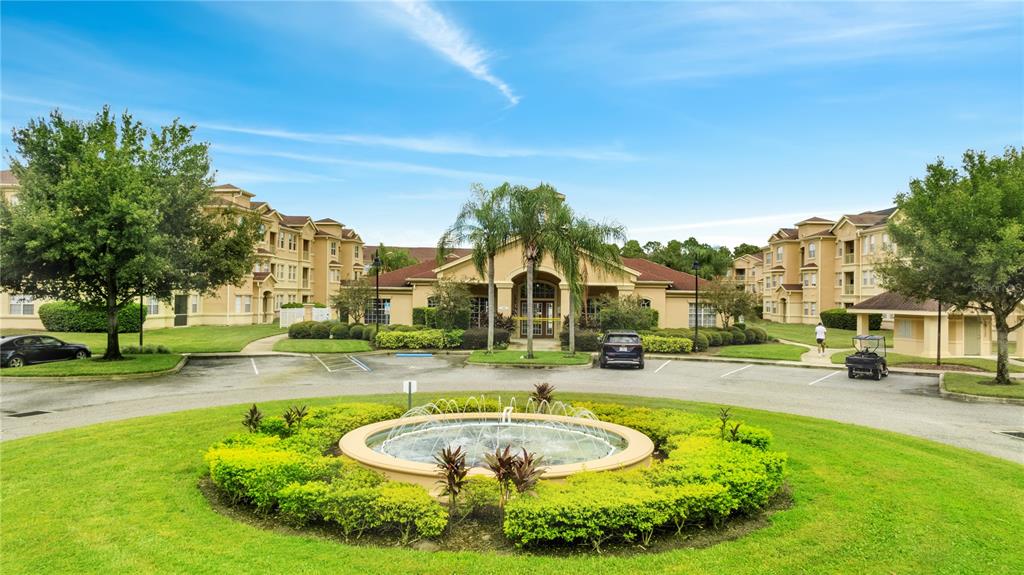 505 Terrace Ridge Circle, Unit 505 Davenport, FL 33896 - Photo 46 of 47 a swimming pool with outdoor seating and yard