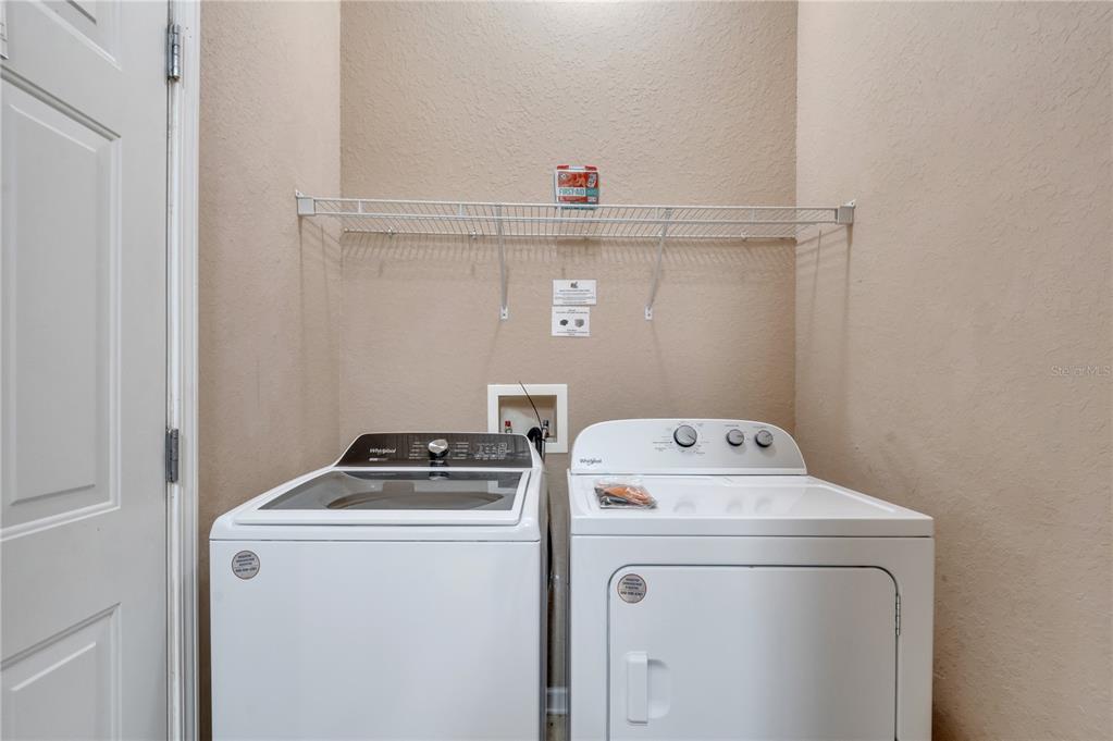 505 Terrace Ridge Circle, Unit 505 Davenport, FL 33896 - Photo 10 of 47 a utility room with dryer and washer