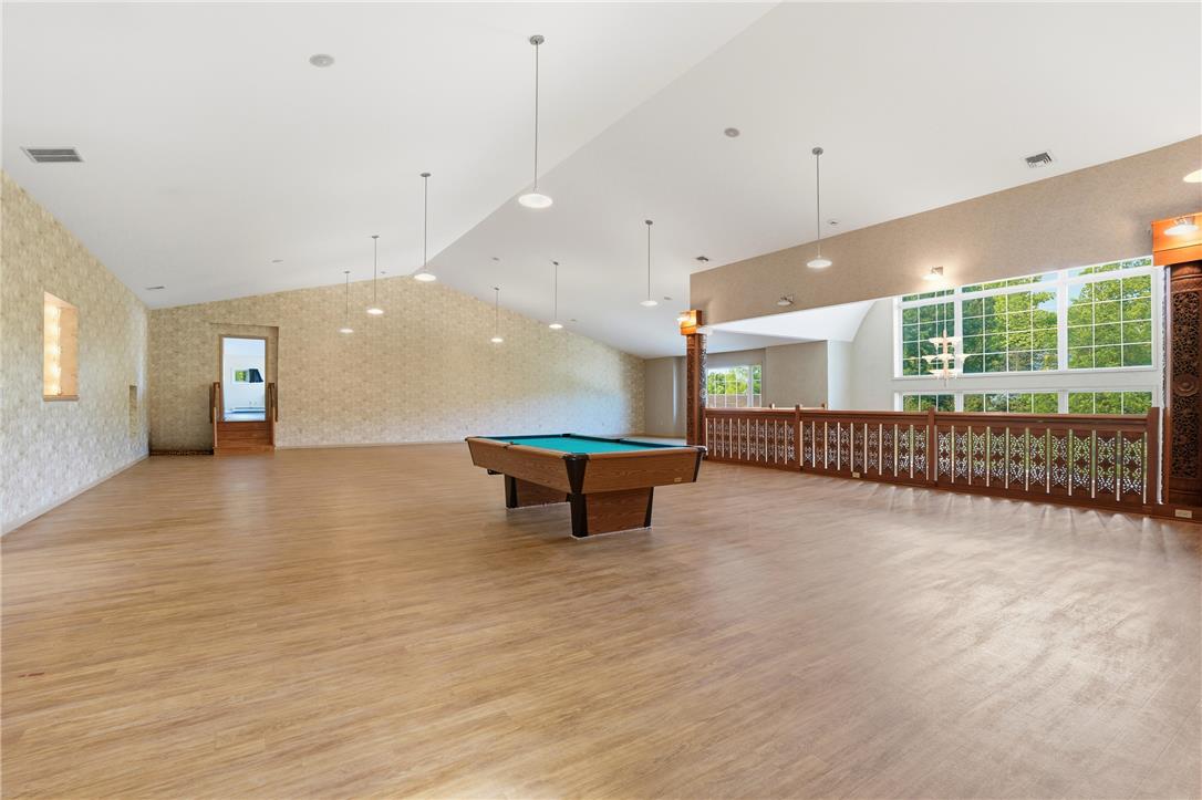 6271 Batman Road Zionsville, PA 18092 - Photo 69 of 100 A spacious game room features high ceilings and polished wood flooring, ideal for entertaining.