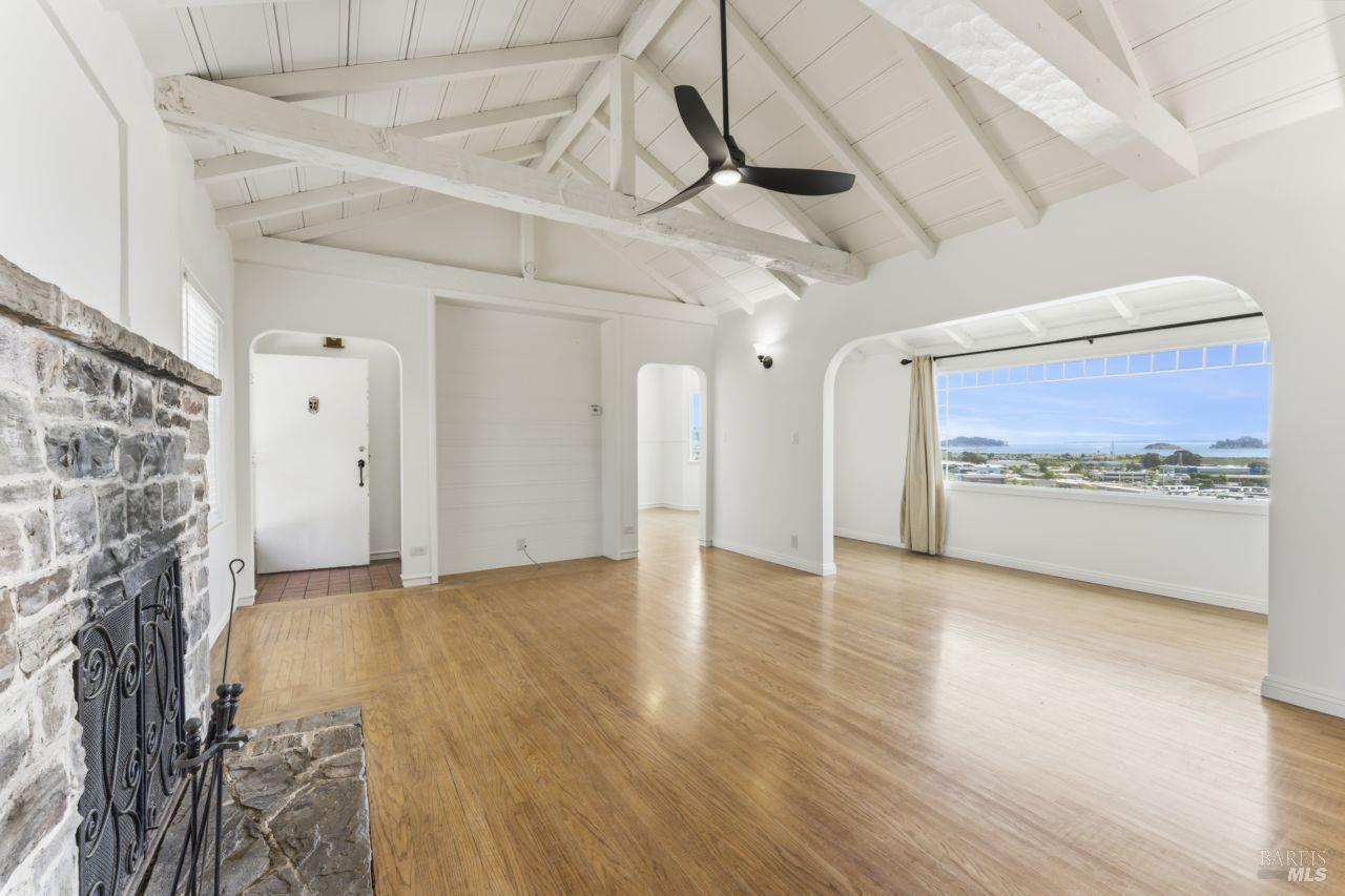 a view of an empty room with a fireplace