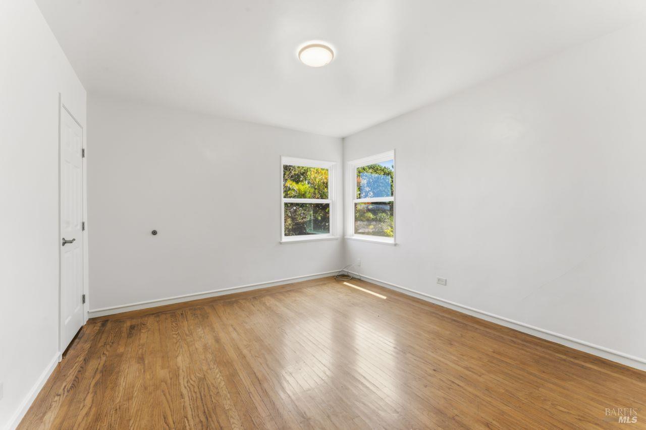 111 Altena Street San Rafael, CA 94901 - Photo 15 of 46 an empty room with wooden floor and windows