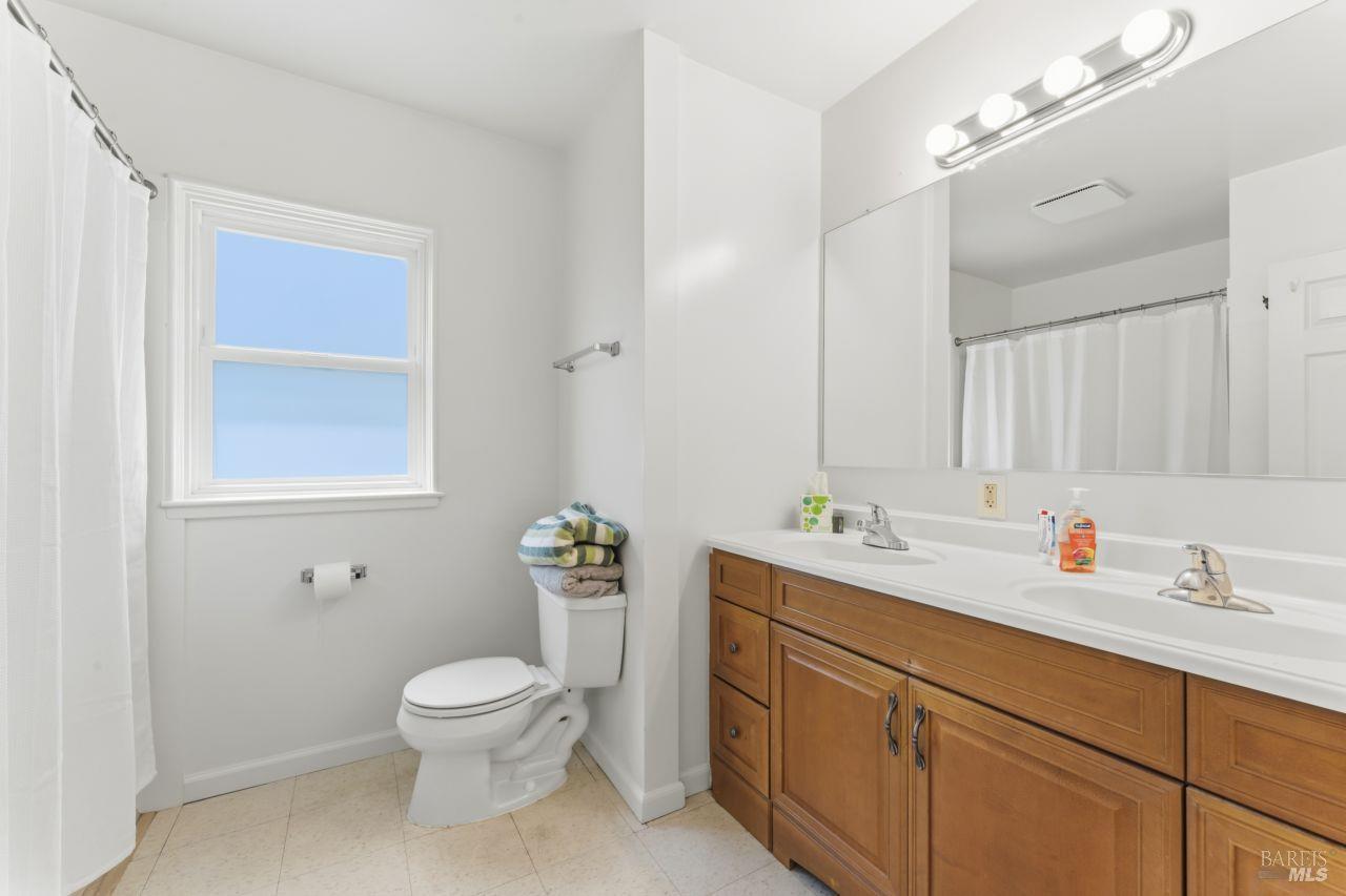 111 Altena Street San Rafael, CA 94901 - Photo 16 of 46 a bathroom with a toilet sink and mirror