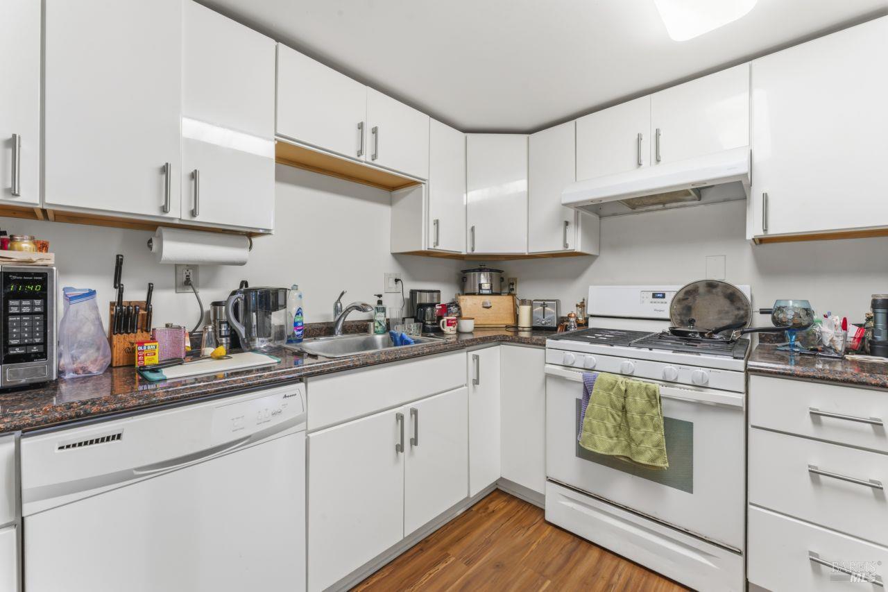111 Altena Street San Rafael, CA 94901 - Photo 28 of 46 a kitchen with stainless steel appliances granite countertop a sink a stove and cabinets