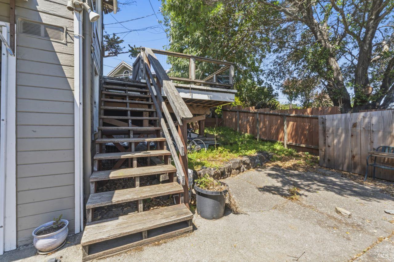 111 Altena Street San Rafael, CA 94901 - Photo 36 of 46 a view of a yard with wooden fence and a bench