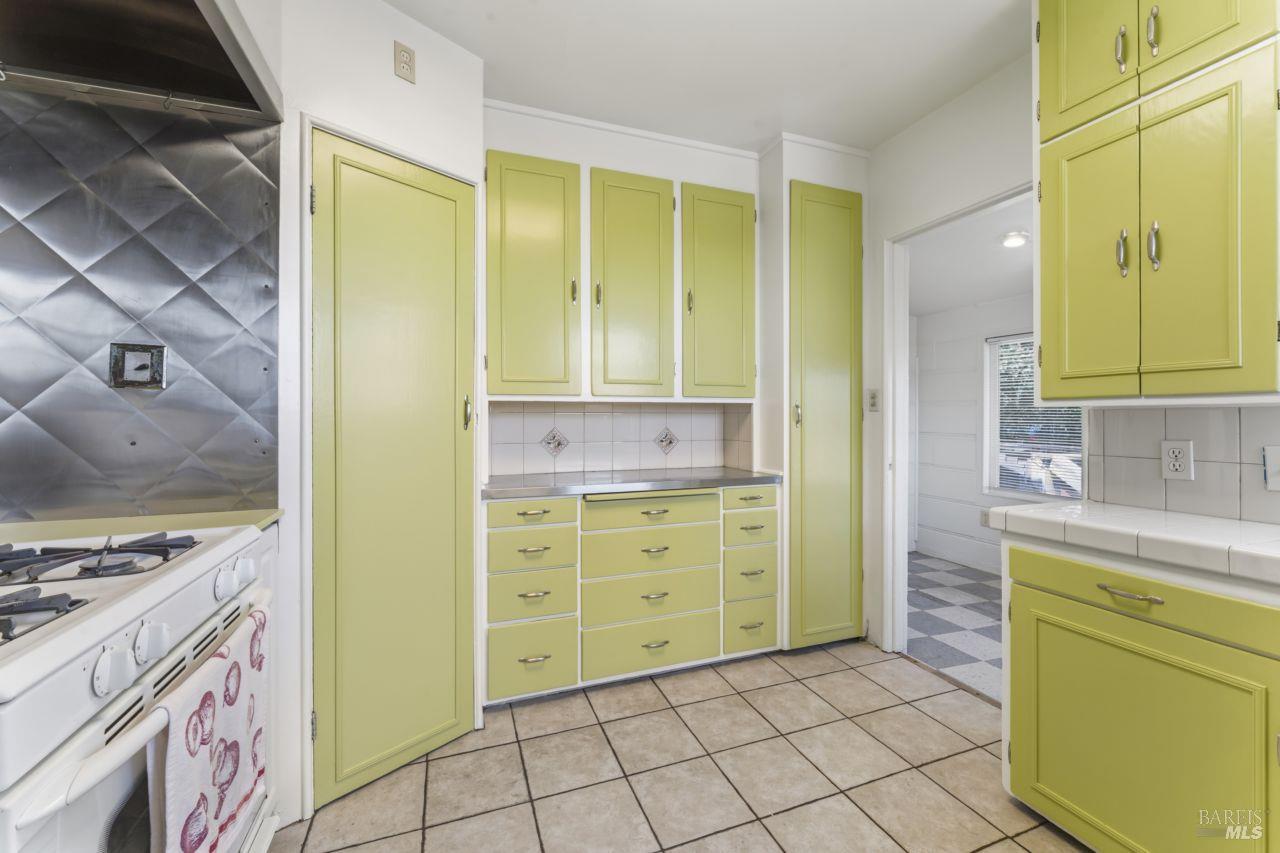 111 Altena Street San Rafael, CA 94901 - Photo 6 of 46 a bathroom with a granite countertop sink and a mirror