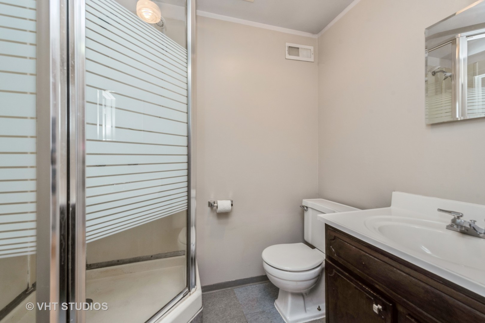 637 Sycamore Road Buffalo Grove, IL 60089 - Photo 15 of 23 a white toilet sitting next to a bathroom sink