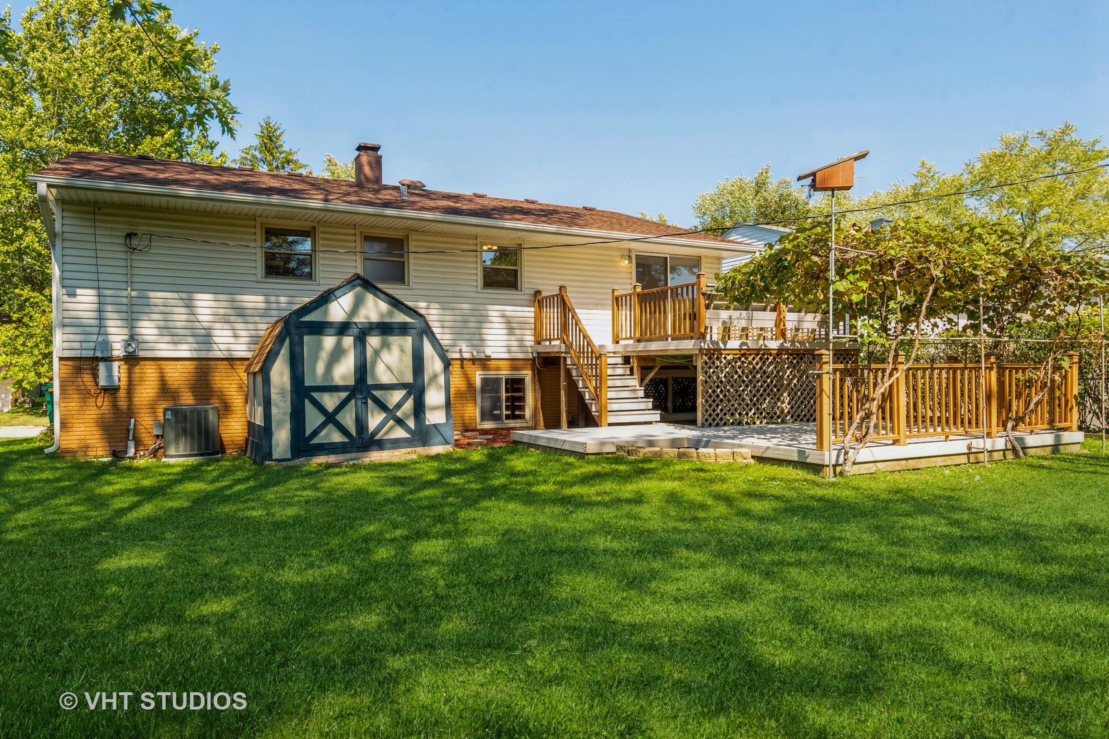 637 Sycamore Road Buffalo Grove, IL 60089 - Photo 19 of 23 a view of a house with a yard