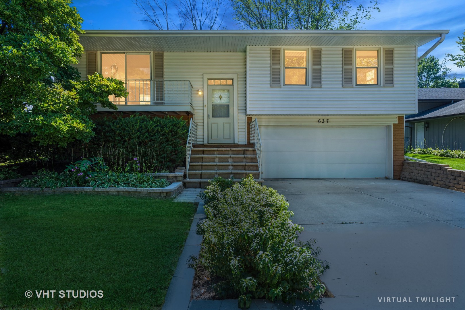 637 Sycamore Road Buffalo Grove, IL 60089 - Photo 3 of 23 a front view of a house with garden