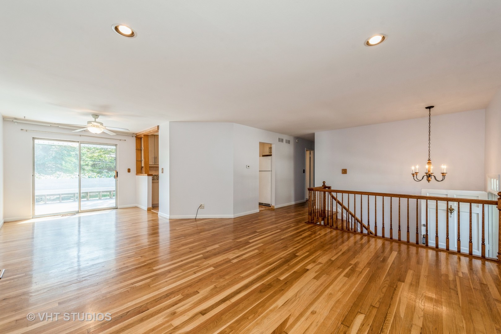 637 Sycamore Road Buffalo Grove, IL 60089 - Photo 5 of 23 a view of an empty room with wooden floor and a window