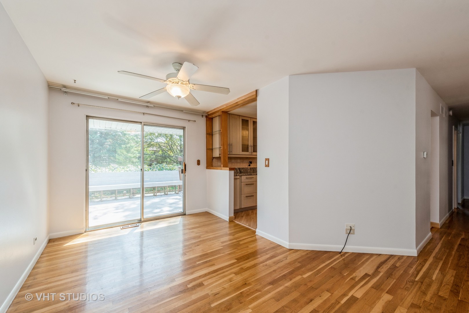 637 Sycamore Road Buffalo Grove, IL 60089 - Photo 8 of 23 a view of empty room with wooden floor and fan