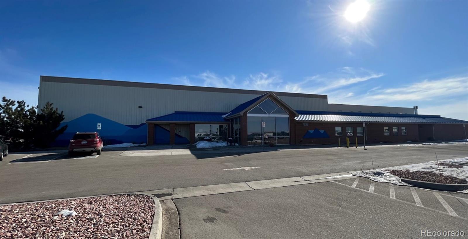239 Adams Street Bennett, CO 80102 - Photo 4 of 5 a car parked in front of house