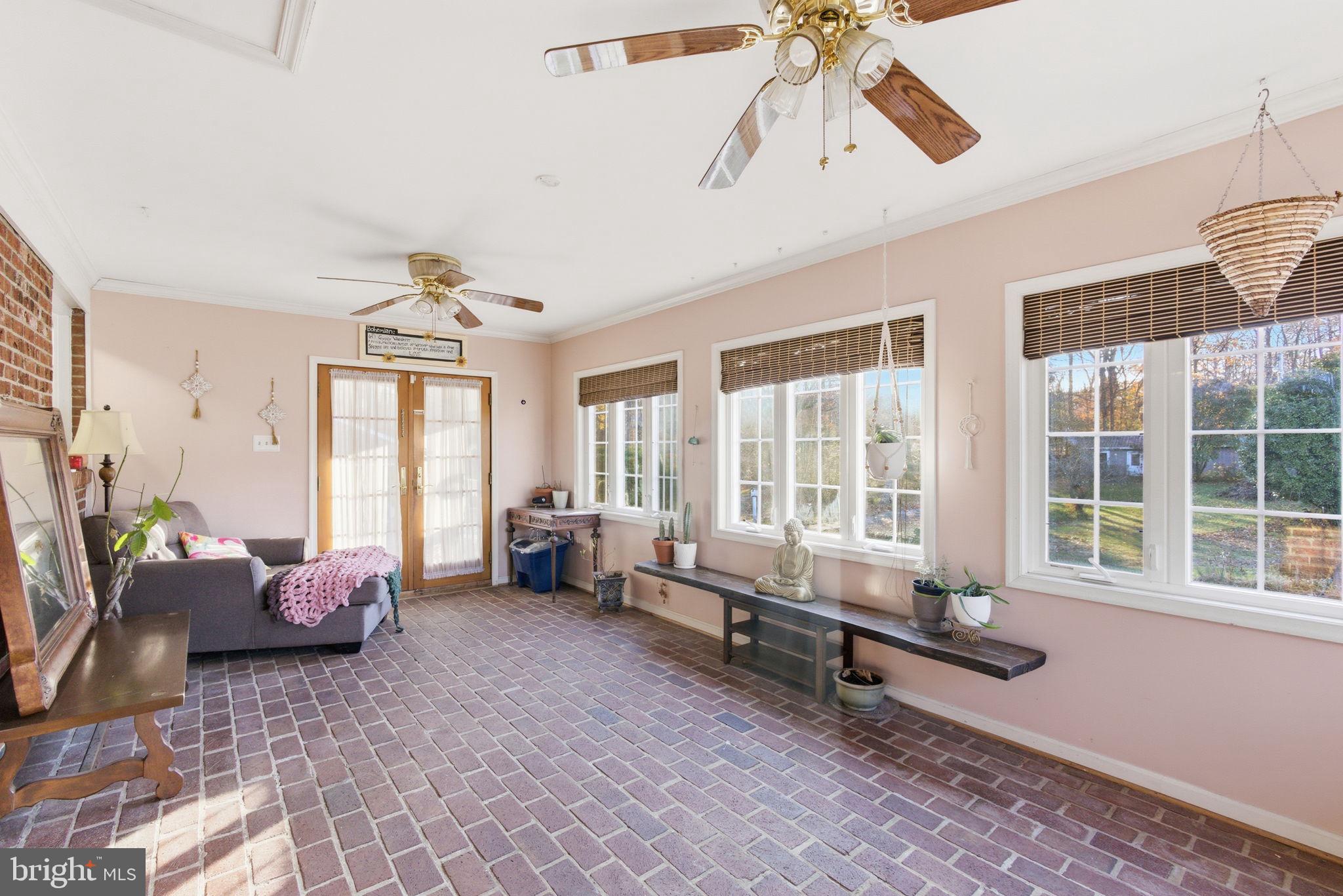 9769 Trinity Church Road Charlotte Hall, MD 20622 - Photo 15 of 61 a living room with furniture and a large window