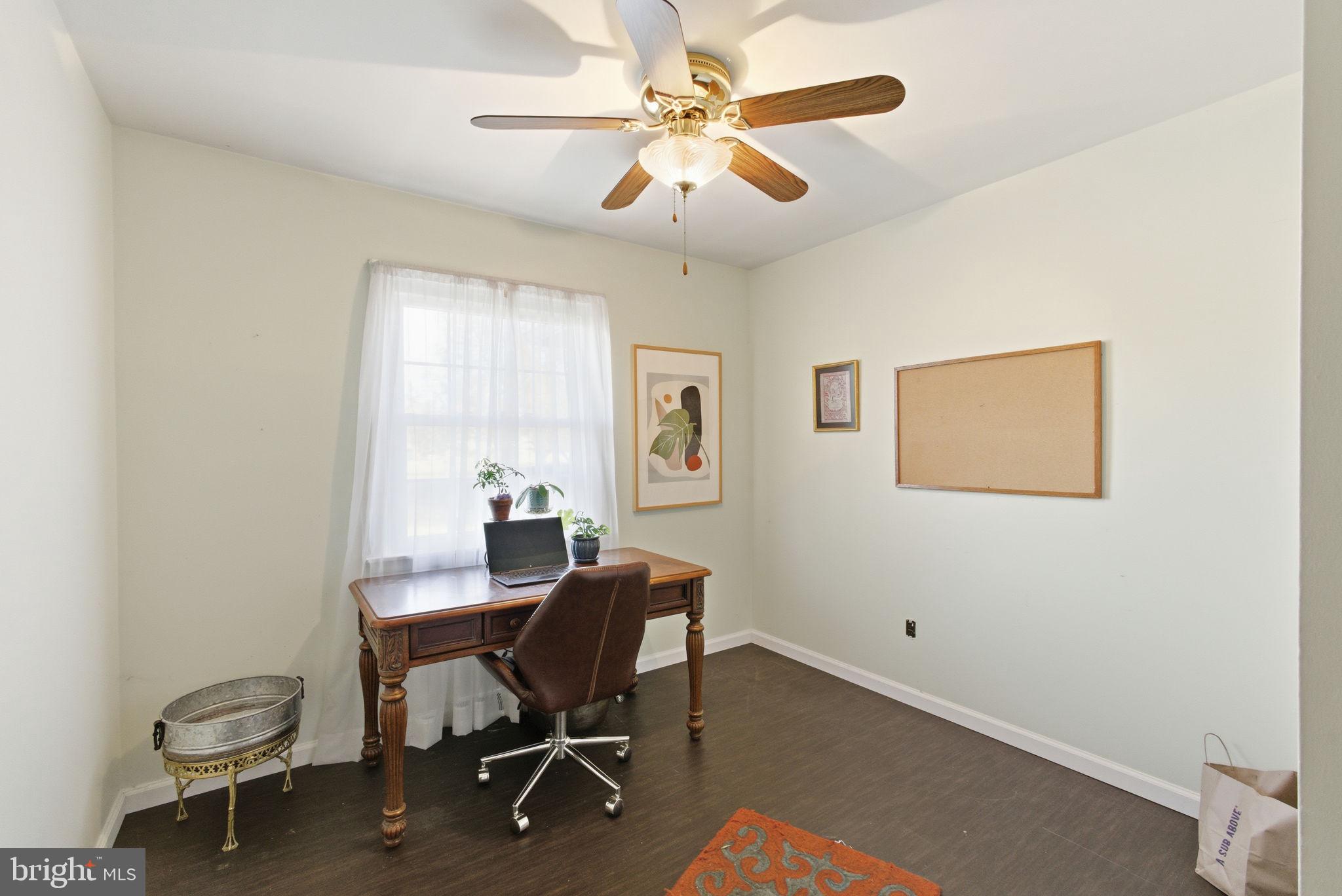 9769 Trinity Church Road Charlotte Hall, MD 20622 - Photo 20 of 61 a view of a workspace with furniture and a window