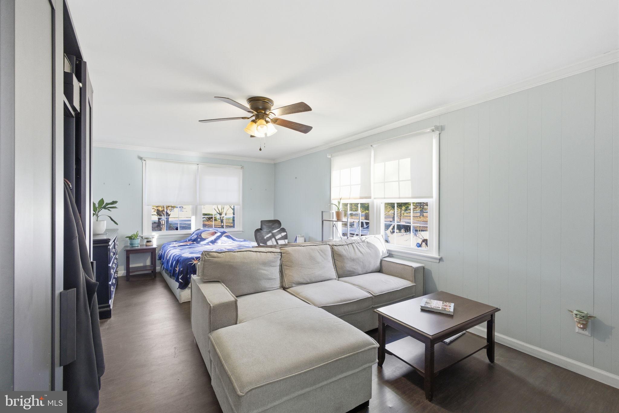 9769 Trinity Church Road Charlotte Hall, MD 20622 - Photo 29 of 61 a living room with furniture and a large window