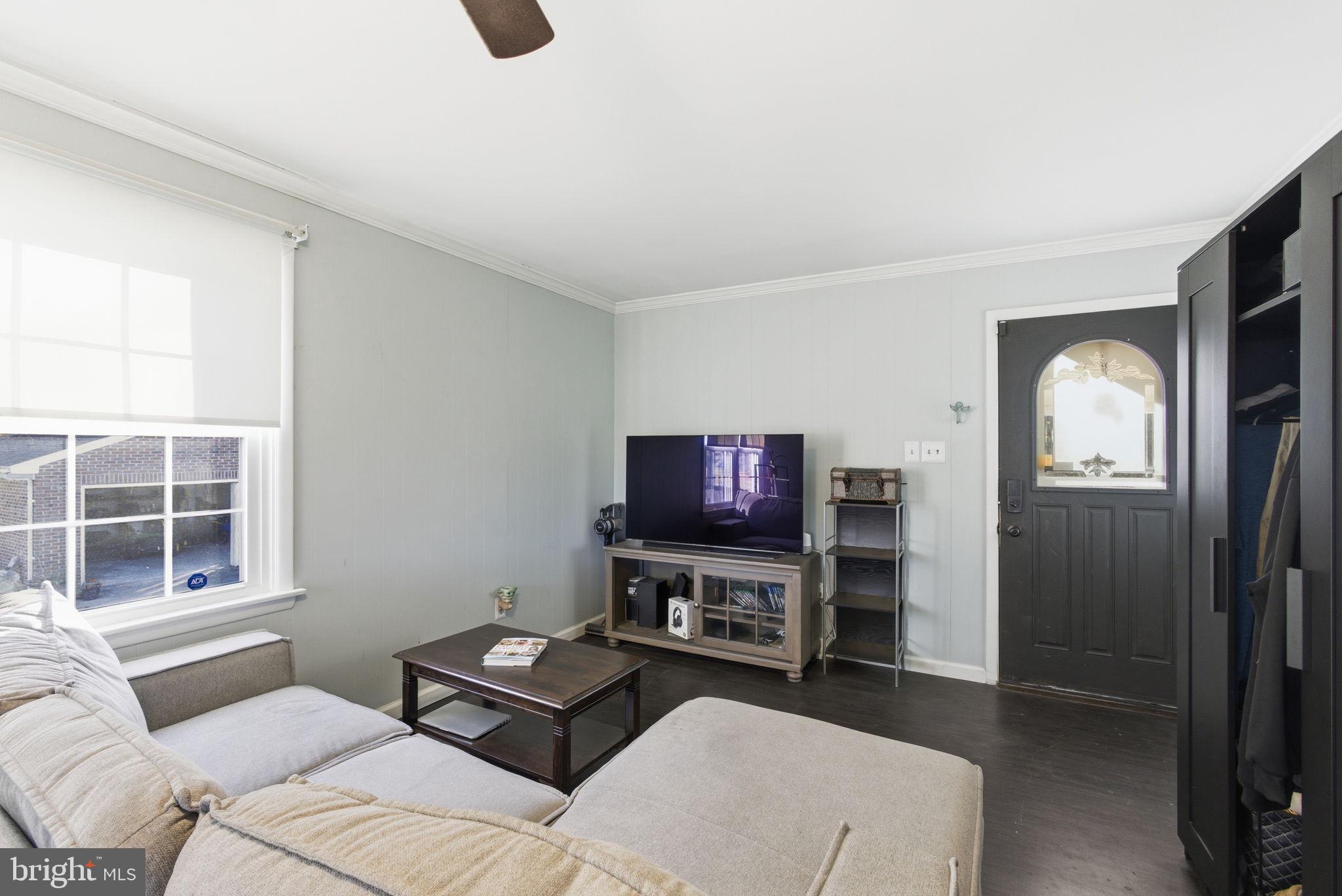 9769 Trinity Church Road Charlotte Hall, MD 20622 - Photo 30 of 61 a living room with furniture and a flat screen tv