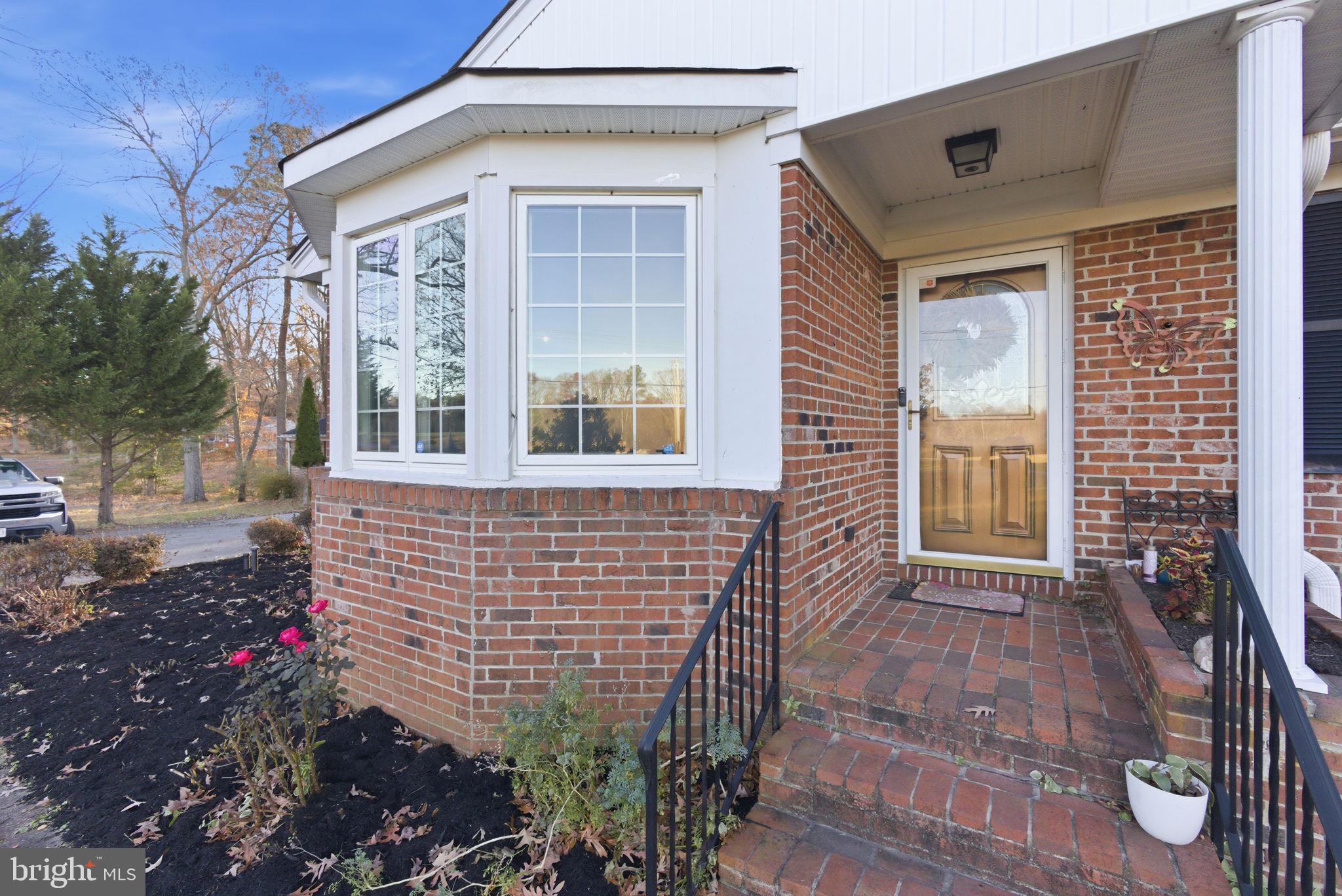 9769 Trinity Church Road Charlotte Hall, MD 20622 - Photo 32 of 61 a front view of a house with a porch