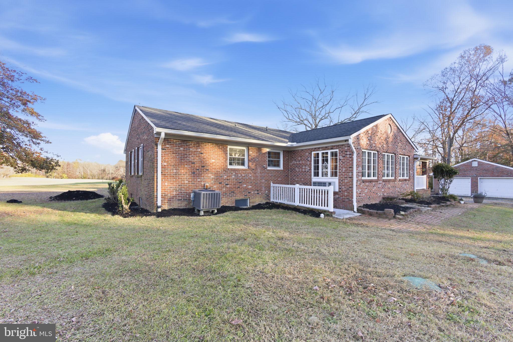 9769 Trinity Church Road Charlotte Hall, MD 20622 - Photo 35 of 61 a view of a house with a big yard and large trees