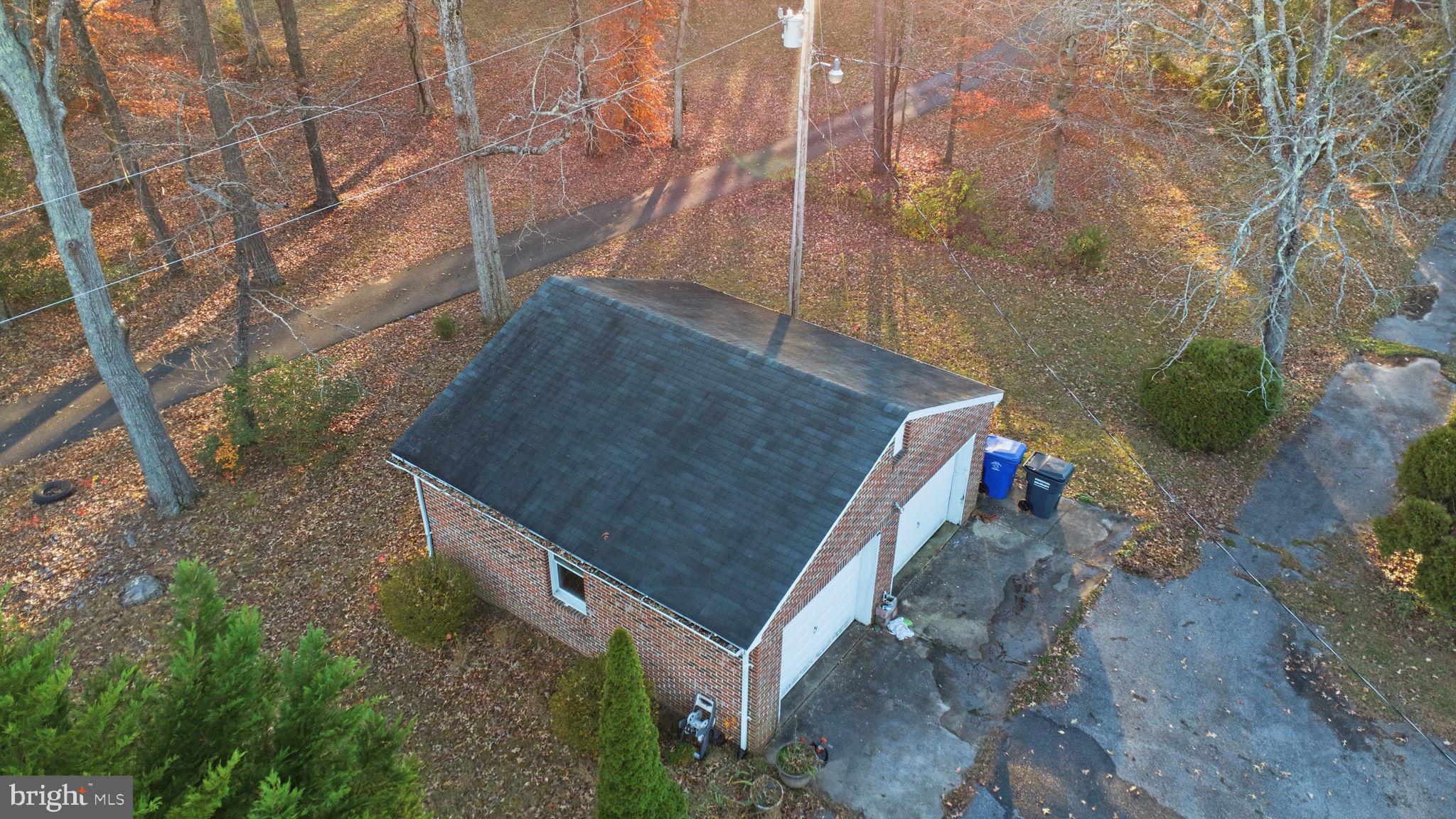 9769 Trinity Church Road Charlotte Hall, MD 20622 - Photo 45 of 61 a aerial view of a house with a yard