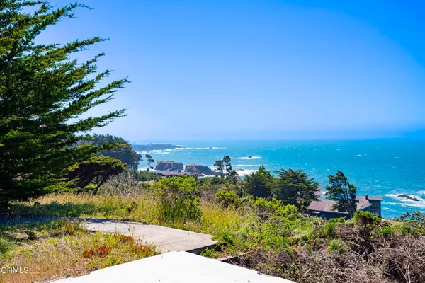 a view of a beach with a ocean view
