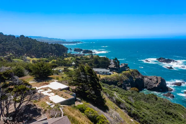 a view of a lake with a yard