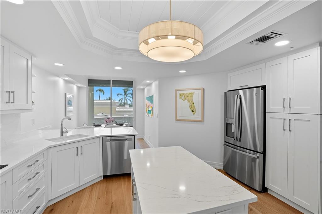 445 Dockside Drive, Unit B202 Naples, FL 34110 - Photo 16 of 50 The Kitchen Features Ample Storage and Counter Space for Cooking.