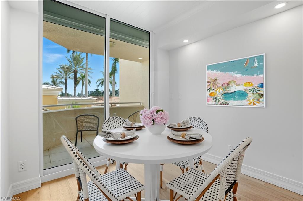 445 Dockside Drive, Unit B202 Naples, FL 34110 - Photo 22 of 50 a dining room with furniture and window