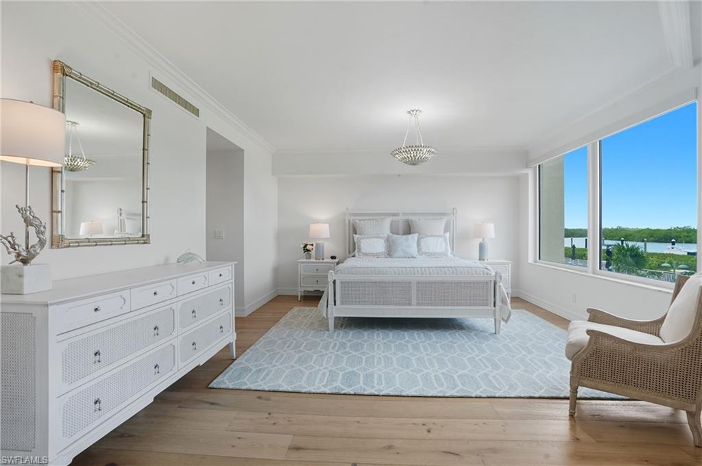 445 Dockside Drive, Unit B202 Naples, FL 34110 - Photo 24 of 50 Fresh, Coastal Chic Furniture in the Master Bedroom.