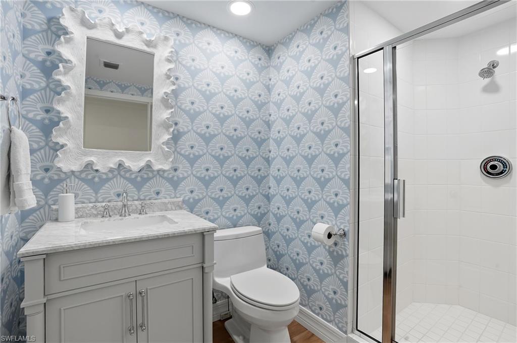 445 Dockside Drive, Unit B202 Naples, FL 34110 - Photo 28 of 50 Bathroom #2 Features Coastal Accents and a Walk-In Shower.