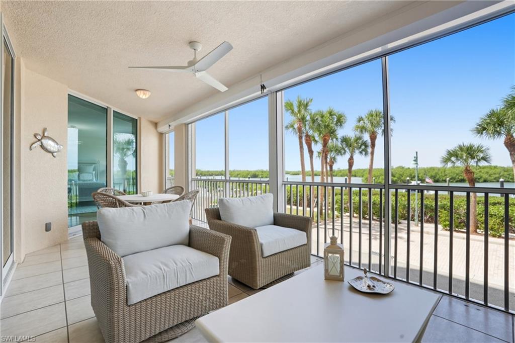 445 Dockside Drive, Unit B202 Naples, FL 34110 - Photo 36 of 50 Electronic Shutters for Added Protection on the Lanai.