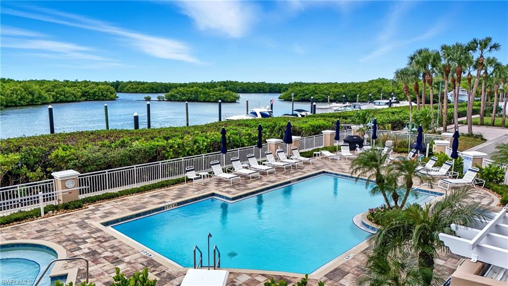 445 Dockside Drive, Unit B202 Naples, FL 34110 - Photo 49 of 50 a view of a swimming pool with a patio