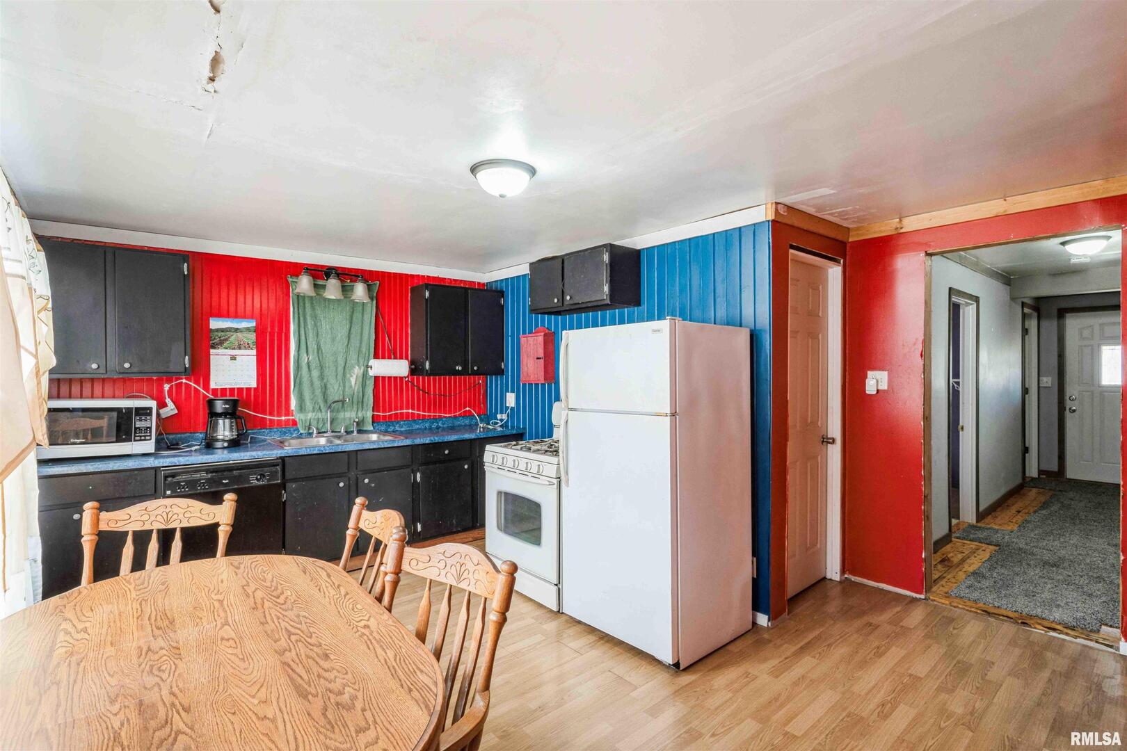 305 East 3rd Street Mineral, IL 61344 - Photo 16 of 22 a kitchen with stainless steel appliances granite countertop a refrigerator and a stove