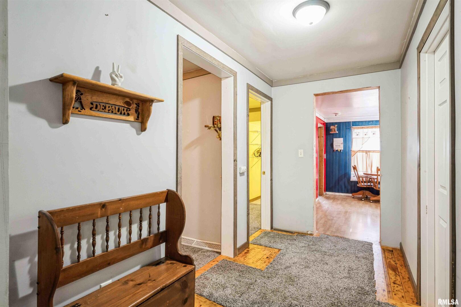 305 East 3rd Street Mineral, IL 61344 - Photo 8 of 22 a view of hallway with livingroom and stairs