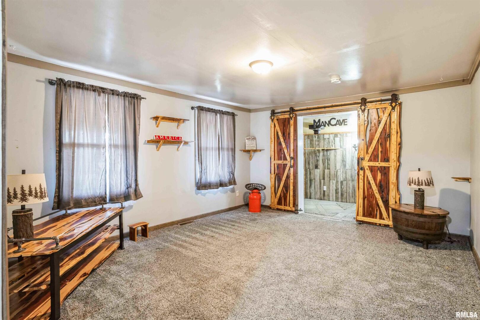 305 East 3rd Street Mineral, IL 61344 - Photo 10 of 22 a view of a room with gym equipment and a large window