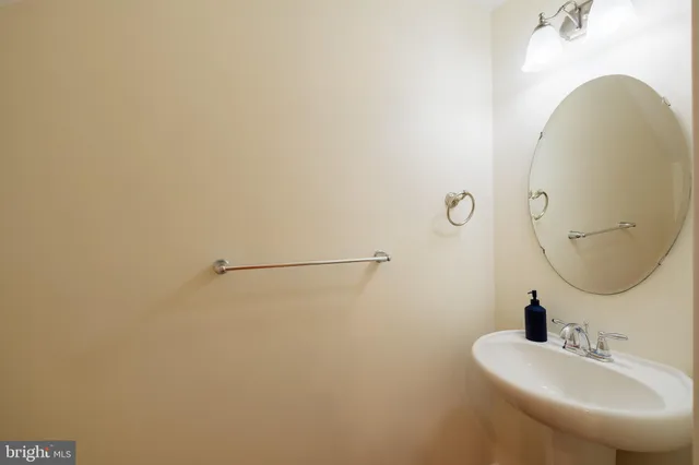 a bathroom with a sink and mirror