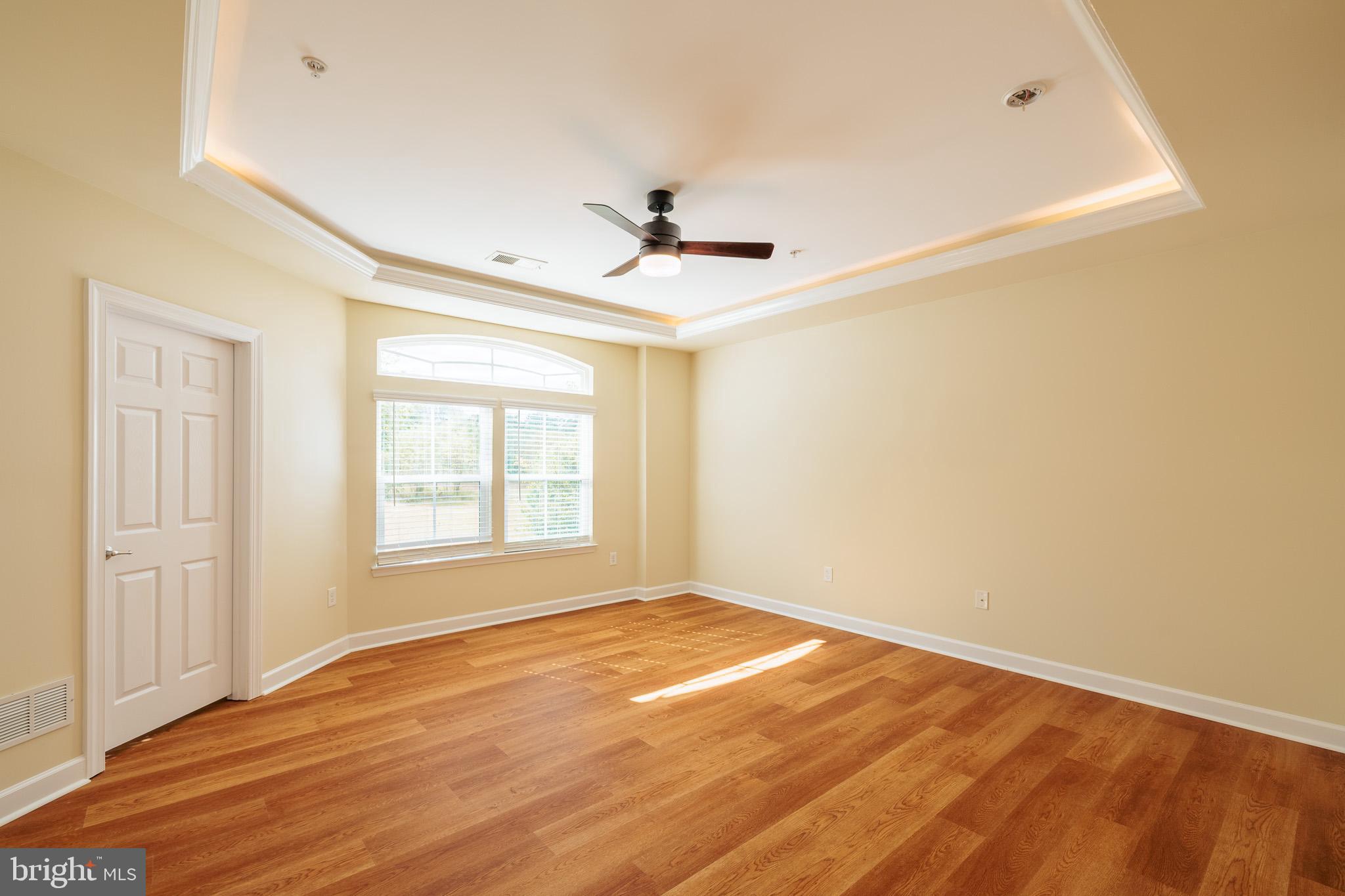 256 Urban Avenue, Unit 256 Gaithersburg, MD 20878 - Photo 25 of 41 a view of empty room with wooden floor and fan