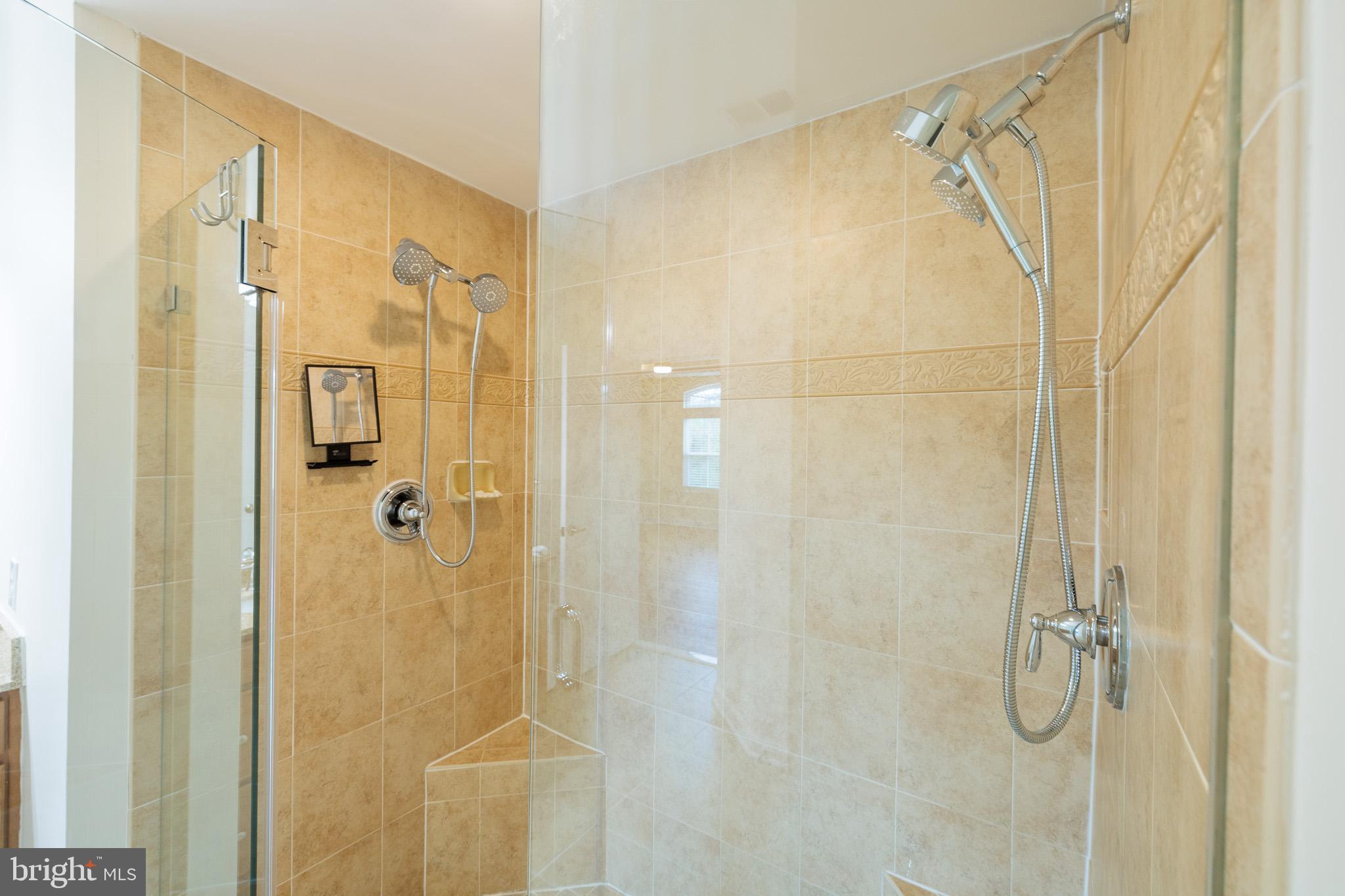 256 Urban Avenue, Unit 256 Gaithersburg, MD 20878 - Photo 28 of 41 a bathroom with a shower and a glass door