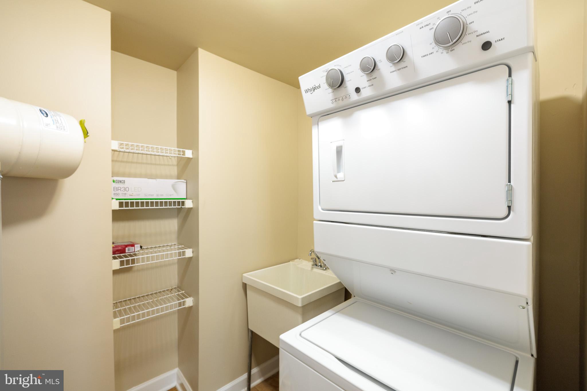 256 Urban Avenue, Unit 256 Gaithersburg, MD 20878 - Photo 30 of 41 a close up of a washer and dryer